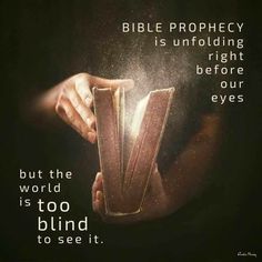 a person holding an open book with the words bible prophecy is unfolding right before our eyes