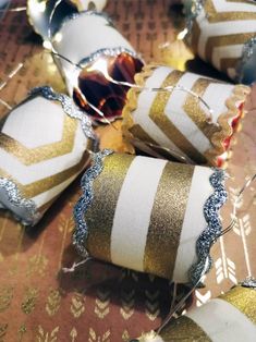 some gold and white ornaments on a table