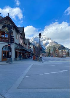 a town square with mountains in the background