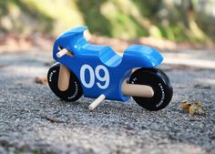 a blue toy car with the number 90 on it