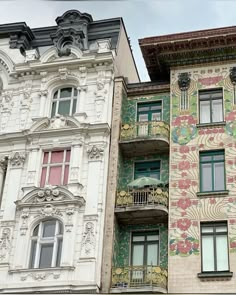 two multicolored buildings with windows and balconies