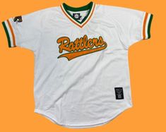 a baseball jersey with the word baltimore in orange and green on it, against an orange background