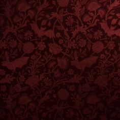 a red wallpaper with flowers and birds on the side, in an ornate pattern