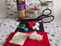 the supplies needed to make this christmas craft include yarn, cotton balls, scissors and glue