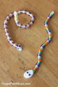 a beaded halloween necklace with a ghost face on it