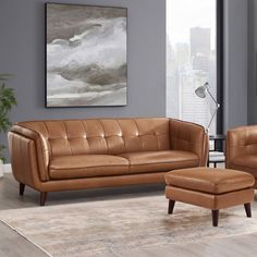 a brown leather couch and chair in a living room