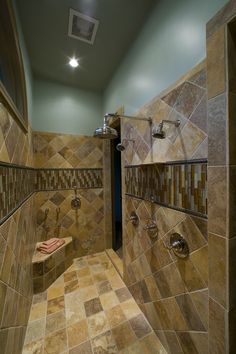 a walk in shower sitting inside of a bathroom