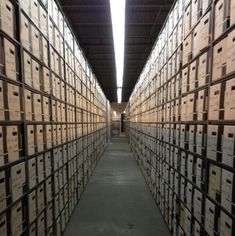 rows of boxes are lined up in the warehouse