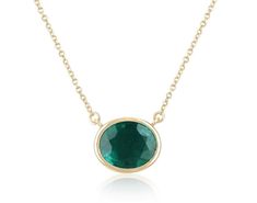 Introducing a captivating solitaire emerald necklace, adorned with a breathtaking 3.20-carat oval cut emerald. Set horizontally in a full bezel setting, the emerald showcases a deep, rich green color, with semi-transparent clarity and a delightful play of luster. Crafted in luxurious 14k gold, the necklace features a dainty cable chain that can be effortlessly adjusted from 18 to 16 inches in length, ensuring a perfect fit and adding a touch of versatility to this elegant piece. Setting Style: B Luxury Emerald Pendant Necklace With Bezel Setting, Luxury Green Oval Necklaces, May Emerald, Emerald Set, Oval Pendant Necklace, Emerald Style, Halo Necklace, Solitaire Necklaces, Emerald Necklace