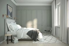 a bedroom with gray walls and white furniture