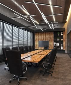 an empty conference room with wooden tables and black chairs