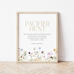 a wooden frame with flowers on it in front of a wall that says, pacificr hunt