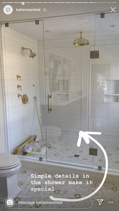 an image of a bathroom setting with the shower door open and toilet next to it