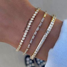 Bezel Set Bridal Bracelet, Diamond Tennis Bracelet, Bar Setting Baguette And Round Cut Moissanite Bracelet, Engagement Bracelet In 18k Gold    ✹✹𝐖𝐞𝐥𝐜𝐨𝐦𝐞 𝐭𝐨 𝑻𝒉𝒆𝑩𝒂𝒏𝒅𝒔𝑺𝒉𝒐𝒑✹✹ ★ 𝑺𝒕𝒐𝒏𝒆𝒔 𝑫𝒆𝒕𝒂𝒊𝒍𝒔 ★ ● Stone Type:- Simulated Diamond, Moissanite ● Color:- DEF ● Clarity: VVS-VS ● Cut Grade: Excellent ● Making Process: Handmade - Crafted by our experienced team ⇨ 1st Bracelet:- ✎ Stone Shape: Round Cut ✎ Stone Size: 3.00 mm  ⇨ 2nd Bracelet:- ✎ Stone Shape: Baguette Cut ✎ Stone Size: 5x2.50 mm ⇨ 3rd Bracelet:- ✎ Stone Shape: Round Cut ✎ Stone Size: 4.00 mm ★ 𝑰𝒕𝒆𝒎 𝑫𝒆𝒕𝒂𝒊𝒍𝒔:- ☛ Metal Purity: Solid Gold (10KT, 14KT, 18KT); Silver(925 Sterling, 935 Argentium), 950 Platinum ☛ Metal Tone: Yellow, White, Rose ☛ Stamp/Hallmark: Yes ★ 𝑪𝒖𝒔𝒕𝒐𝒎𝒊𝒛𝒂𝒕𝒊𝒐𝒏:- ☛ Cus Luxury Brilliant Cut Baguette Diamond Bracelet, Luxury Classic Bracelet With Baguette Diamonds, Luxury Diamond Baguette Bracelet For Formal Occasions, Luxury Classic Bracelets With Baguette Diamonds, Luxury Gold Baguette Cut Bracelet For Formal Occasions, Luxury Gold Bracelet With Baguette Diamonds, Luxury Baguette Bracelets For Wedding, Luxury Elegant Gold Bracelet With Baguette Cut, Luxury Baguette Bracelets For Anniversary