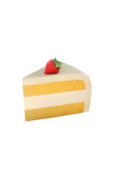 there is a piece of cake with a strawberry on top and yellow stripes around it