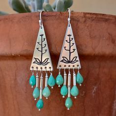 These stunning earrings feature a lovely Blooming Agave carving and Chrysoprase stone drops. Agaves are one of my favorite sources of inspiration. I love the color and shape variations found in the Sonoran Desert. Each of these Agaves was meticulously hand carved by me, (not stamped). No two are exactly alike even within the pair. The variation gives them character and shows they were made by hand. The earring wires are also hand forged. The finish is satin, not too shiny. The minty green Chryso Bohemian Sterling Silver Chandelier Earrings With Natural Stones, Handmade Turquoise Chrysoprase Earrings, Handmade Chrysoprase Dangle Jewelry, Century Plant, Plant Jewelry, Desert Cactus, Minty Green, Earring Wires, Focal Points