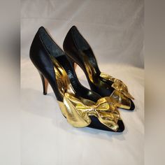 These Vintage Beverly Feldman Fabric Heels Have A Beautiful Gold Bow Across The Toe. It's Such A Fun Heel That Can Be Worn With Anything. New, Never Worn, In Great Vintage Condition. Small Scuff On The Right Bow. Ask Me Any Questions. Size 7.5 Satin-Like Fabric Heel, Gold Leather Bow 3.5" Heel. Black And Gold Retro Court Shoes For Party, Retro Court Shoes With 4-inch Heel For Party, Retro Round Toe Evening Heels, Retro Round Toe Heels For Evening, Retro Closed Toe Heels For Party, Retro Heels For Party, Retro Pointed Toe Court Shoes For Party, Retro Party Heels With Sculpted Heel, Retro Open Toe Party Heels