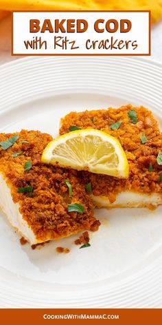 two pieces of baked fish on a white plate with lemon wedges and parsley