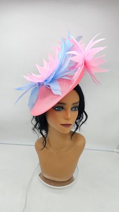 This stunning  piece is sure to turn heads with any outfit. Pink Fascinator with light blue accents on an adjustable headband for a secured. This will be a great way to add elegance to any,  bridesmaid,  rehearsal dinner,  Wedding guest,  cocktail party, or church outfit. - Ready to ship  - Lightweight - Fast shipping - Customize by adding different color flowers and or feathers Check my store for for styles and colors.  etsy.com/shop/hatsandpearls Find more at my website: Www.hatsandpearls.com  reach out to me if you can't find what you are looking for.  I can make cake custom orders and help you style and match your outfit Whimsical High Crown Fascinator For Party, Light Blue Headpiece For Royal Ascot Party, Light Blue Headpiece For Kentucky Derby Party, Kentucky Derby Costume Party Adjustable Fascinator, Light Blue Mini Hat For Kentucky Derby Party, Adjustable Fascinator For Spring Costume Party, Spring Costume Party Adjustable Fascinator, Adjustable Pink Carnival Hat, Blue Structured Crown Hat For Spring