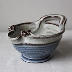 a blue and white bowl sitting on top of a table