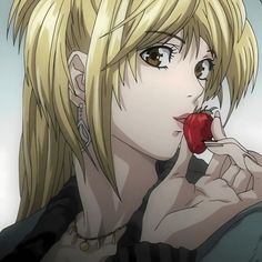 a blonde haired woman holding an apple in her hand