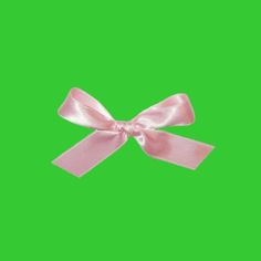 a pink bow on a green screen