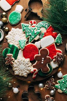 decorated christmas cookies on a wooden platter