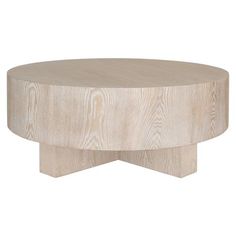 a round wooden table sitting on top of a white floor