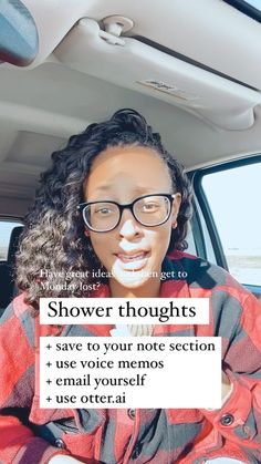 a woman wearing glasses sitting in the back seat of a car