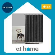 a black shower curtain with the words at home on it and an image of a chair