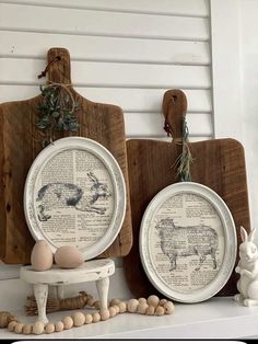 two plates with animals on them are sitting next to some chopping boards and eggs