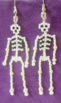 the skeleton earrings are made out of beads