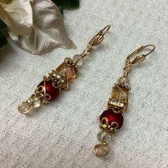 These Are Handmade And Wire Wrapped By Hand With Lever Back Ear Wires, Crystal Cubes, Red Glass Pearls And Gold Accents. Comes In An Organza Bag! Elegant Holiday Earrings For Festive Occasions, Elegant Festive Holiday Earrings, Elegant Holiday Festive Earrings, Elegant Holiday Jewelry With Matching Earrings, Elegant Gold Jewelry For Holidays, Elegant Gold Jewelry For Holiday, Elegant Holiday Gold Jewelry, Elegant Beaded Earrings For Holiday, Elegant Gold Earrings For Holiday