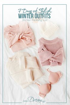 four sweaters and two cups on a bed with text overlay that reads, 7 days of stitch winter outfits winter packing list