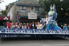 a float with people on it in a parade