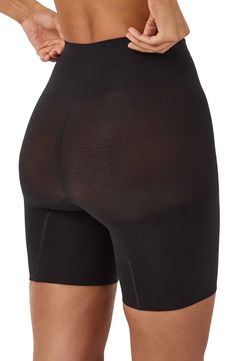 Feel supported in these shaping shorts made with seamless knitting that targets your core for a smooth look that's invisible under clothes. Lined gusset 55% nylon, 45% elastane Machine wash, tumble dry Imported Black Compression Elastane Shorts, Compressive Black Shorts With Contoured Waistband, Black Compressive Shorts With Contoured Waistband, Compression Seamless Black Shorts, Black Compression Seamless Shorts, Black Micro-elastic Elastane Shorts, Black Seamless Elastane Shorts, Compressive Black Smoothing Hosiery, Black Seamless Mid-thigh Bottoms