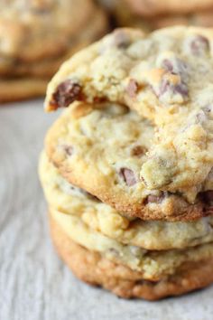 three chocolate chip cookies stacked on top of each other