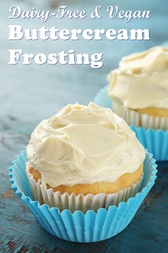 two frosted cupcakes sitting on top of blue paper wrappers with the words dairy - free and vegan buttercream frosting