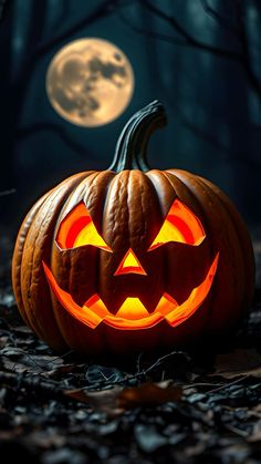 a carved jack o lantern in front of a full moon