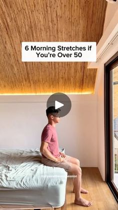 a young boy sitting on top of a bed with the words 6 morning stretches if you're over 50