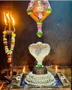 an elaborate display with candles and garlands