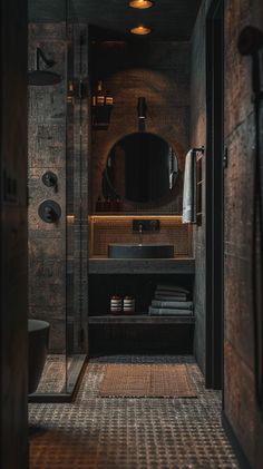 a bathroom with a sink, mirror and shower stall