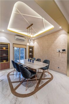 a dining room table with blue chairs around it