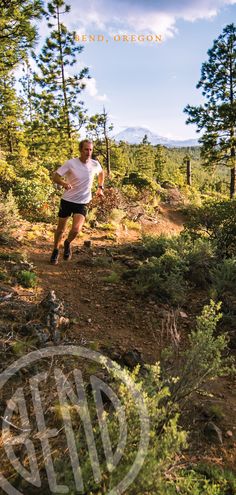 a man running down a trail in the woods