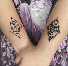 two tattoos on the arms of people with flowers and diamond shapes in front of them