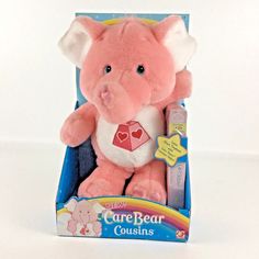 a pink stuffed animal with a heart on it's chest