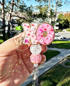 Valentine's Day cookie beaded badge reel Details: ~ 2" acrylic blank  ~ 2 20mm acrylic beads ~ Front: Hand glitter, permanent vinyl and sealed with resin for extra protection ~ Faux sprinkles  Care instructions:  ~ Handle with care ~ Acrylics are fragile and can break if dropped or knocked against hard surfaces ~ Acrylics can be wiped clean with a lint-free cloth  ~ Avoid prolonged exposure to heat or water as it may cause acrylic to weaken Reel options: Option 1: Alligator clip Option 2: Belt c Handmade Pink Badge Reel For Gift, Multicolor Beaded Badge Reel As Gift, Valentines Badge Reel, Christmas Badge Reel, Nurse Crafts, Holiday Badge Reel, Nurse Badge Holders, Valentines Day Cookies, Beaded Lanyards