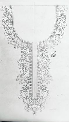 a drawing of an ornate design on white paper