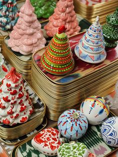 there are many different colored christmas trees on the trays