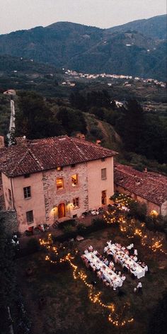 an aerial view of a house with lights on it